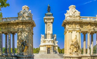 White and Black Concrete Statues Under Blue Sky