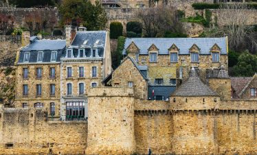 A stunning view of Mont-Saint-Michel's ancient stone architecture in Normandy, France.