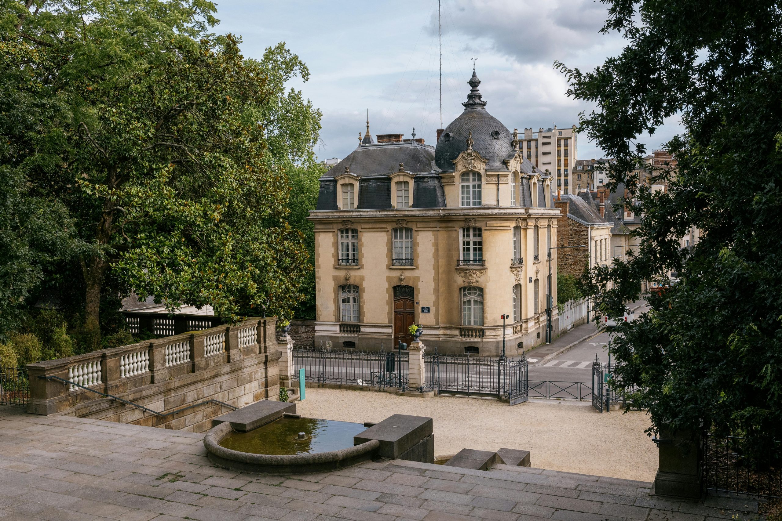 Elegant 19th-century building with garden in the heart of Rennes, France, showcasing classic architecture.