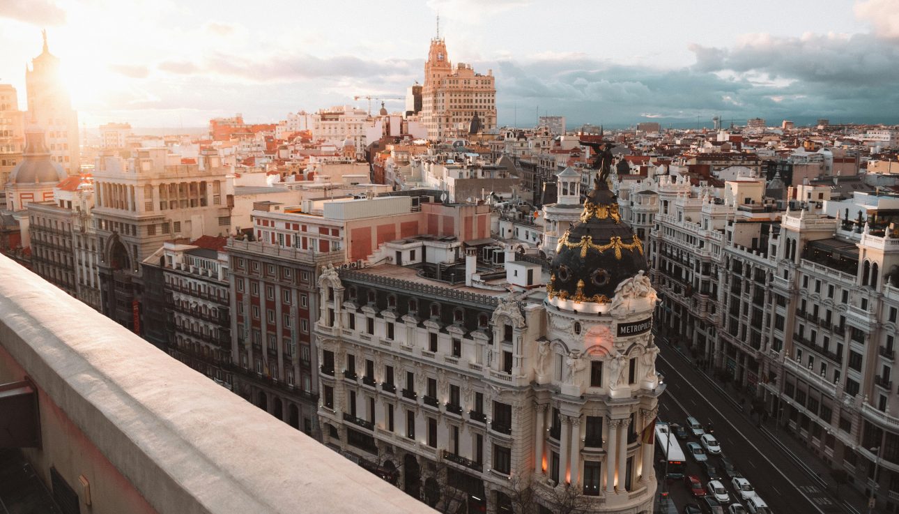 Breathtaking view of Madrid's skyline at sunset featuring the Metropolis Building.
